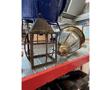 A brass and beveled glass light fitting and an old steel porch light. 