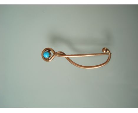 An Edwardian 9 carat gold and turquoise set treble clef stick pin by Merle Bennett & co.  Marked MB & Co 7054.91, 3.3cm long,