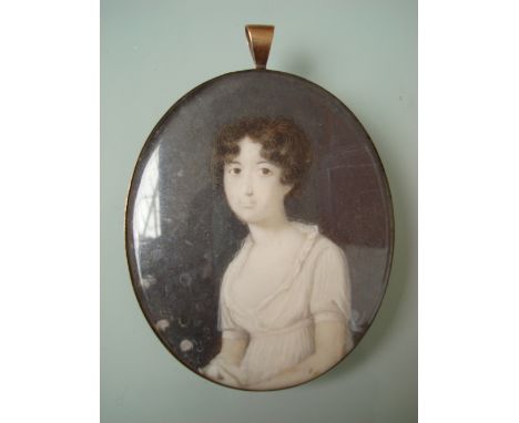 Early 19th Century British School Portrait miniature of a young lady, oval, watercolour on ivory.  Gilt metal frame with susp