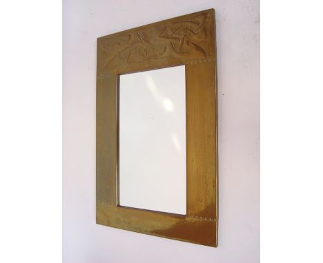 An early 20th Century poss Scottish Arts and Crafts rectangular wall mirror in the manner of Margaret Gilmour, with riveted b