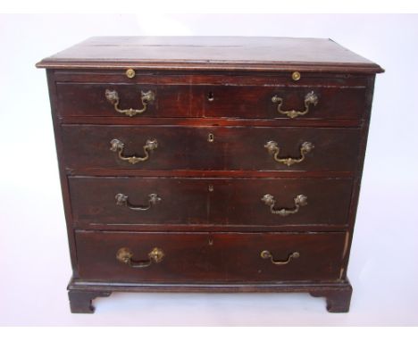 An early George III mahogany bachelors chest of drawers, the top with moulded edge over a brushing slide and four graduated l