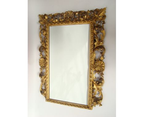 A 19th Century Florentine picture frame mirror, with shell and foliate scroll surround.
61 x 80cm. 