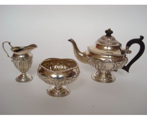 A late Victorian silver batchelors three piece tea service, Birmingham, 1901 by Henry Bourne, each of ogee baluster form, wit