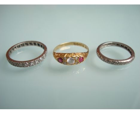 An Edwardian white stone, ruby and diamond ring, in carved scroll setting on 18ct band, size N together with a full diamond 1