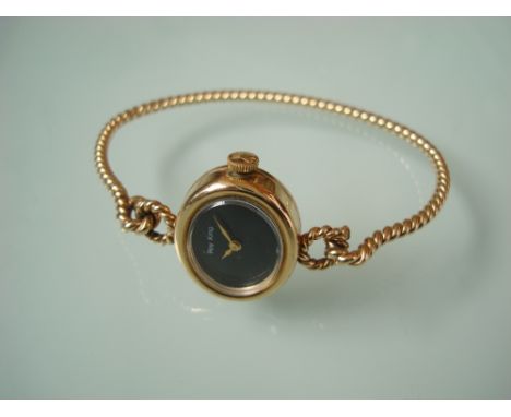 A ladies Roy King 9 carat gold bangle wristwatch, with oval black dial signed Roy King, on a rope twist bangle, approx 14g, i