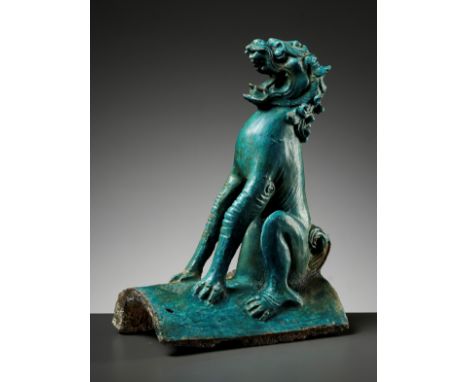 A TURQUOISE-GLAZED 'LION' ROOF TILE, MING DYNASTYChina, early 16th to mid-17th century. Well potted and modeled after its Tan