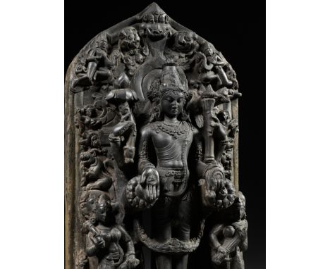 A MASSIVE BLACK STONE TRINITY STELE DEPICTING VISHNU, SARASVATI AND LAKSHMI, PALA PERIODNortheastern India, 11th-12th century
