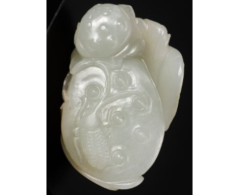 A WHITE JADE 'LOTUS AND BEETLE' PENDANT, 18TH CENTURYChina. Finely carved in openwork as lotus leaves and pods borne on inter