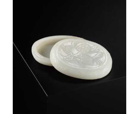 A WHITE JADE 'LYCHEE' BOX AND COVER, LATE MING DYNASTYChina, 16th-17th century. The shallow box of oval form, carved and inci