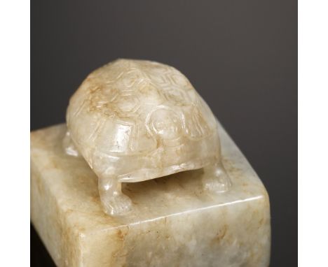 A CELADON JADE 'TURTLE' SEAL, 17TH CENTURY    China. The square seal surmounted by a turtle standing foursquare, its minuscul