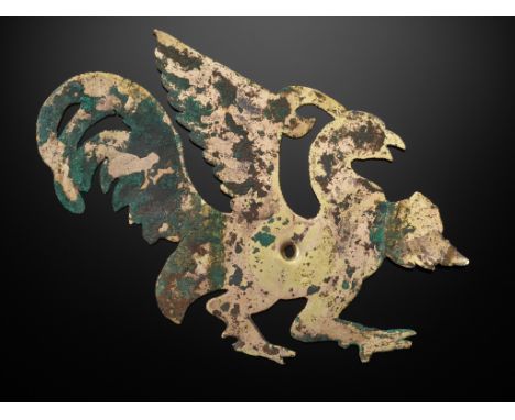 A GILT COPPER ALLOY 'PHOENIX' REPOUSSE ORNAMENT, WARRING STATES PERIODChina, 475-221 BC. The emblem thinly cast and neatly cu