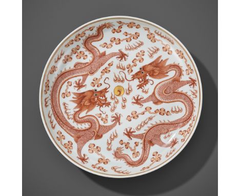 A LARGE IRON-RED AND GILT 'DRAGONS' DISH, GUANGXU MARK AND PERIODChina, 1875-1908. Nicely potted with rounded sides and finel