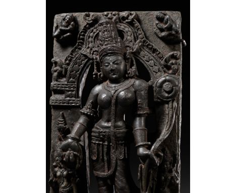 A BLACK STONE STELE OF PADMAPANI, PALA PERIOD, NORTHEASTERN INDIA, BIHAR, 10TH CENTURYHe is dressed in the trappings of royal
