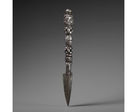 A COPPER-INLAID IRON PHURBHA, TIBET, 15TH-16TH CENTURYThe tripartite blade issuing from the fangs of a makara and with snakes