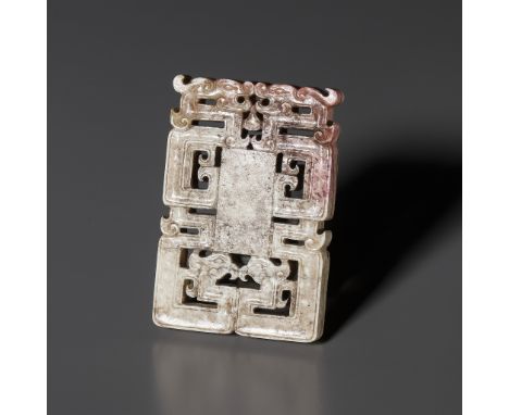 A 'CHICKEN BONE' JADE 'KUI DRAGON' PLAQUE, LATE MING TO EARLY QING DYNASTYChina, 17th to 18th century. Of rectangular form, f