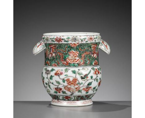 A FAMILLE VERTE 'PHOENIX' PORCELAIN WINE COOLER, KANGXI PERIODChina, 1662-1722. The globular body supported on a short spread