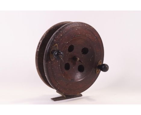 A large vintage 7" wooden fishing reel