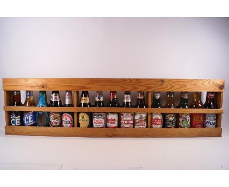 Various bottles of beers and lagers in a display shelf 