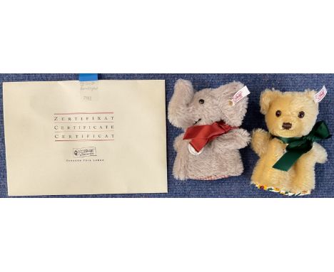 Steiff Egg Cosy Set, Bear and Elephant, 12cm. Limited edition No 02283. With certificate. Bear is wearing a green satin bow a