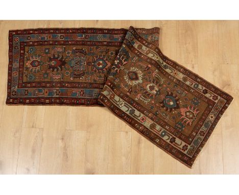 An early to mid 20th century Middle Eastern red, brown and blue ground woollen runner with geometric decoration, 74cm wide x 