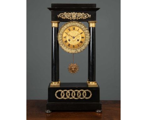 A 19th century French ebonised portico mantle clock the gilt dial with arabic numerals, overall 28cm wide x 14cm deep x 52cm 