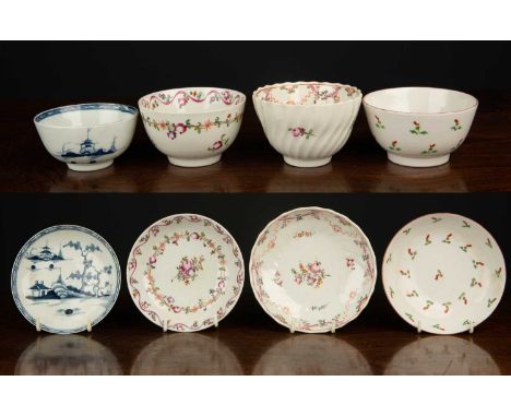 A group of four New Hall tea bowls and saucers, three with floral and foliate decoration, the fourth with blue asian architec