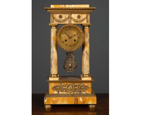 A 19th century French marble portico mantle clock with gilt mounts, the gilded dial with roman numerals, overall 24.5cm wide 