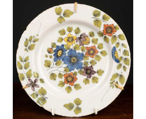 A Fazakerley Delftware plate, with purple, blue, ochre and puce flower and foliate decoration, 23cm diameterCondition report: