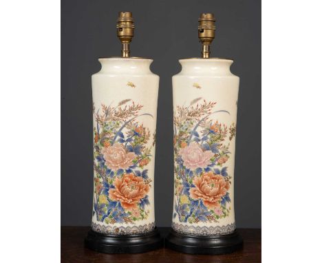 A pair of satsuma style cylindrical ceramic table lamps with flower decoration on turned black painted socles, each 14cm diam
