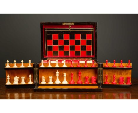 A Victorian coromandel games compendium box with gilt brass pierced strapwork mounts, the compendium opening to reveal a lid 