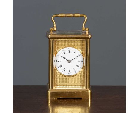 A 20th century brass carriage clock the white enamelled dial marked with roman numerals within textured brass plate, double f