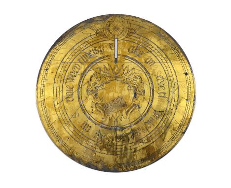 A circular engraved brass sundial plate with central mask and motto, 29cm diameterCondition report: Of modern manufacture, la