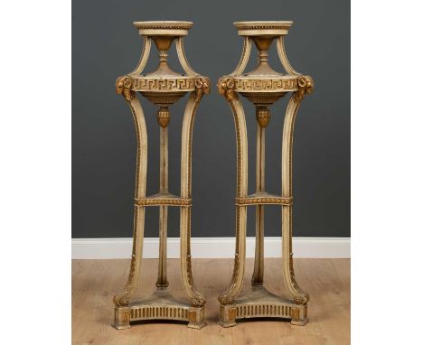 A pair of Adam style torcheres in the classical style, painted and parcel gilt, decorated with bands of Greek key ornament, r