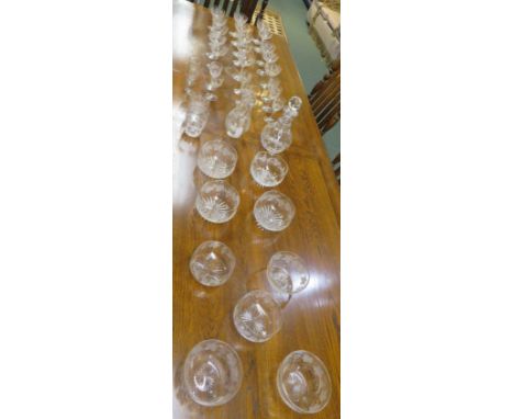 A suite of glass ware including wine glasses, bowls, jug and decanter, etched with vine leaves (in all about thirty-six items