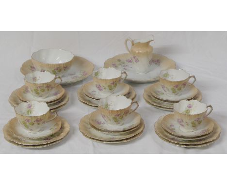 An Edwardian part china tea set, pale blush with foliate decoration, a milk jug, a sugar bowl, two serving plates, six tea cu