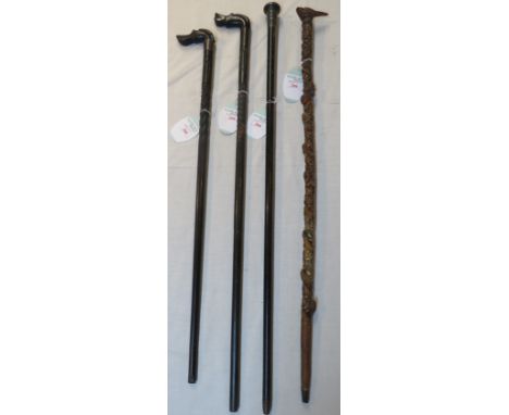 Four walking sticks - an ebonised walking cane with engine turned silver cap, marks for London, 1925, Henry Perkins &amp; Son