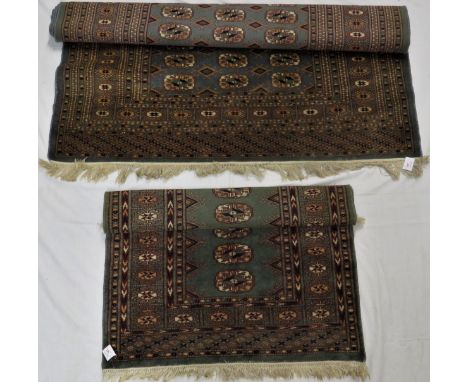 Two small Eastern rugs, mid 20th century - the first of grey-blue ground, four margins with a central panel of forty-five med
