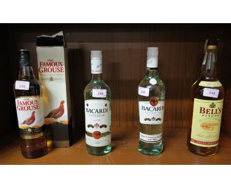 The Famous Grouse 40% 70cl (one bottle, boxed); Bell's Finest Old Scotch Whisky Extra Special 40% 1 litre (one bottle); Bacar