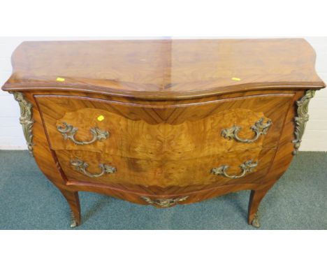French style reproduction bombe commode of two drawers, banded mahogany and walnut veneer, foliate moulded gilt brass handles