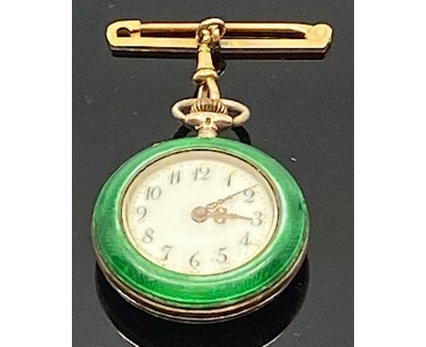 An early 20th century Swiss 935 silver lady's fob watch with green enamel and gilt case, attached with a 9 carat gold pin wit