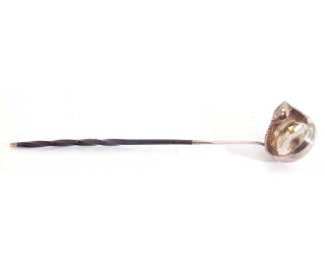 Georgian silver toddy ladle, the bowl with punched rim and plain pouring lip to a baleen twisted long handle, apparently unma