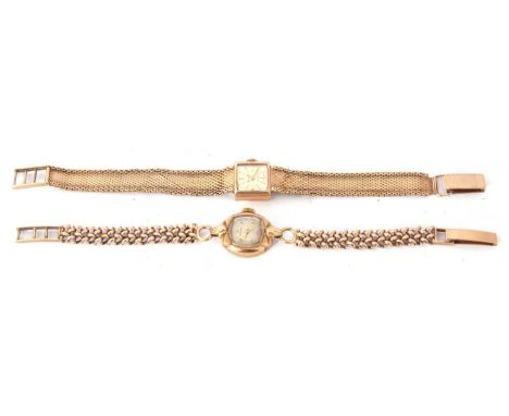 Ladies import hallmarked 9ct gold cased wrist watch with gold hands to a silvered dial with raised gold batons and black pain