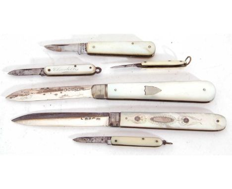 Mixed Lot: Georgian silver and mother of pearl folding fruit knife, the handle with inlaid silver and engraved garland design