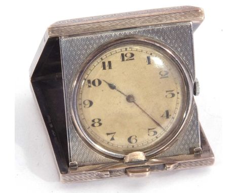 Antique 925 marked travel clock in engine turned folding case, the inside of the case with presentation engraving dated 1935,