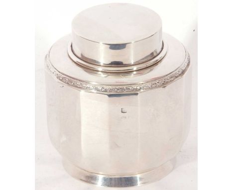 Silver hallmarked panelled caddy of squat baluster form, pull off lid with applied garland edge, plain panelled body to a rou