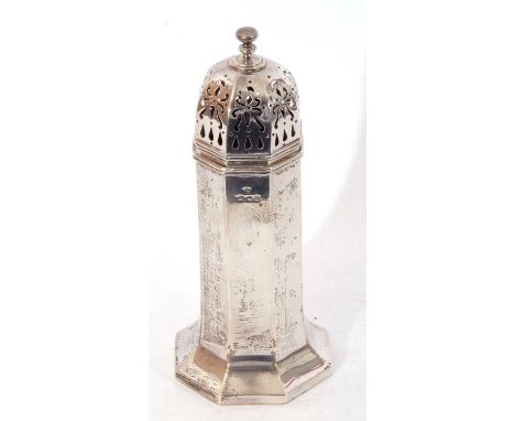 George V silver caster of octagonal panelled form, the pull off pierced lid with urn finial, London 1916, maker's mark Edward