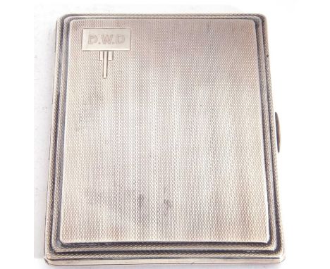 Art Deco silver cigarette case of rectangular form, engine turned decoration with engraved cartouche to one corner, having a 