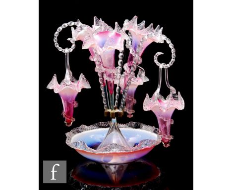 A late 19th Century Stourbridge epergne, the wide frill rim bowl supporting three flared trumpets with moulded angular crimpe