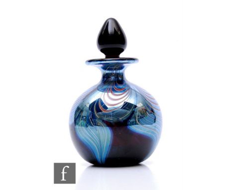 A later 20th Century Okra glass scent bottle of globe form, decorated with silvered pulled trails against the deep amethyst g