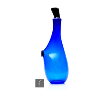 A later 20th Century Simon Moore studio glass decanter of abstract sleeve form in deep blue with applied black spot and angul